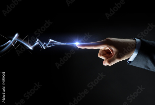 businessman finger connecting to lightning