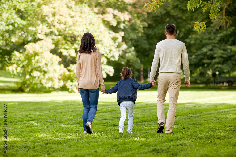 happy family walking in summer park