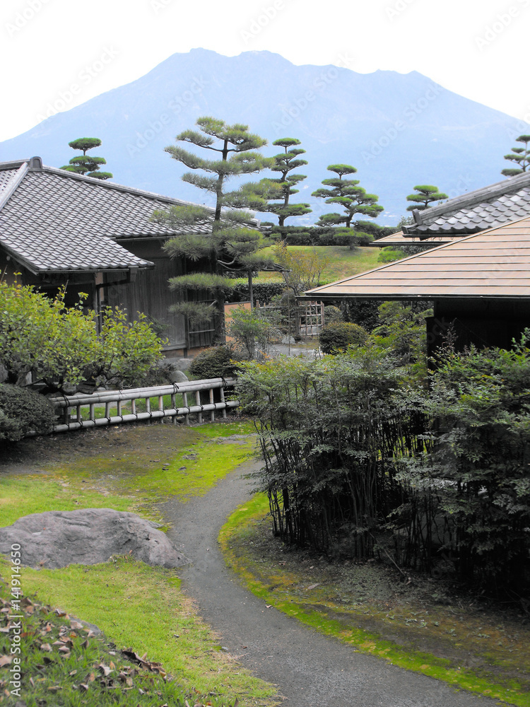 Ancient Residences at the Sengan En Gardens with Sakurajima Mountain background, Kagoshima, Japan Ancient Residences at the Sengan En Gardens with Sakurajima Mountain background, Kagoshima, Japan