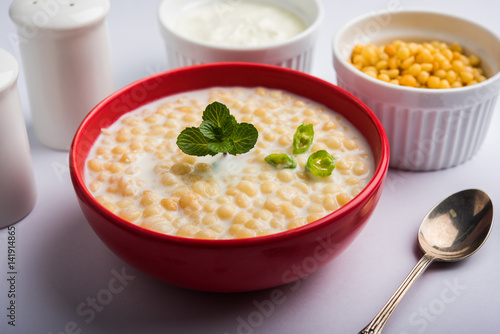 Dahi Bundi or Boondi Raita, favourite indian started or side dish made using Rajasthani snack food made from sweetened, fried chickpea flour, called Boondi with sweet and salty curd or buttermilk photo