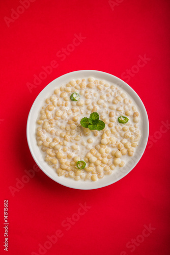 Dahi Bundi or Boondi Raita, favourite indian started or side dish made using Rajasthani snack food made from sweetened, fried chickpea flour, called Boondi with sweet and salty curd or buttermilk photo