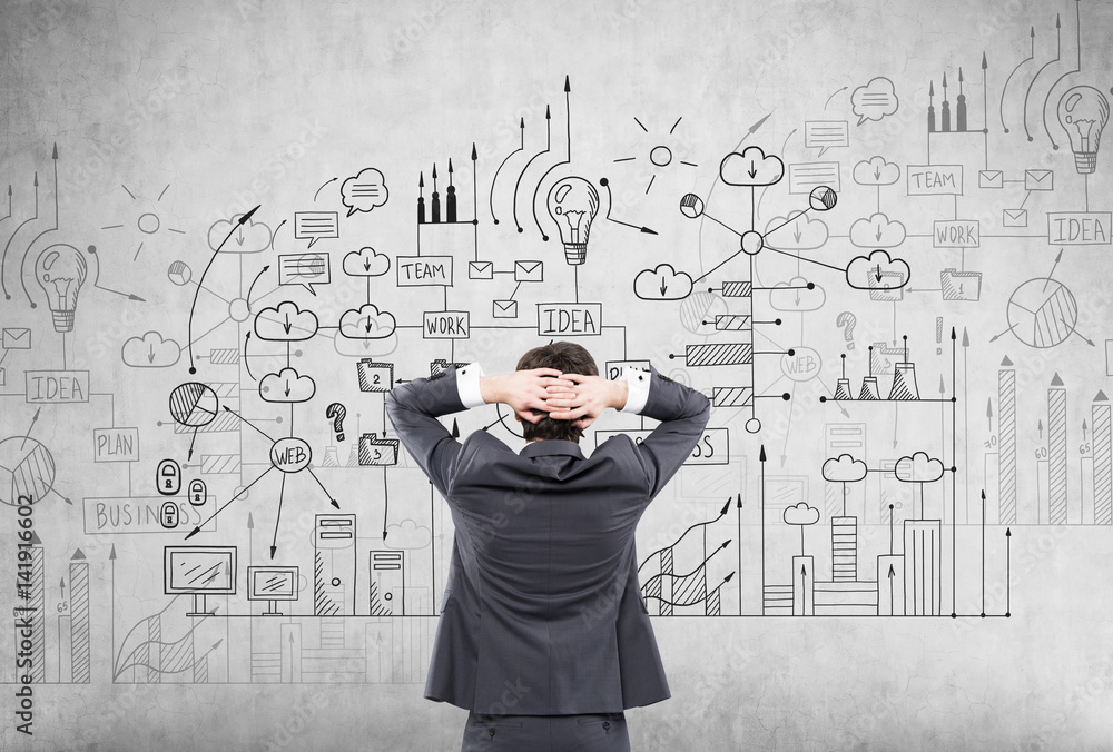 Man examining business scheme, concrete Man examining business scheme, concrete