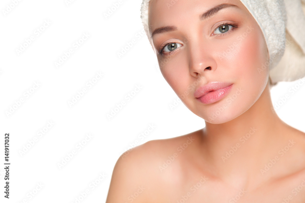 Portrait of beautiful girl touching her face with a towel on head Portrait of beautiful girl touching her face with a towel on head