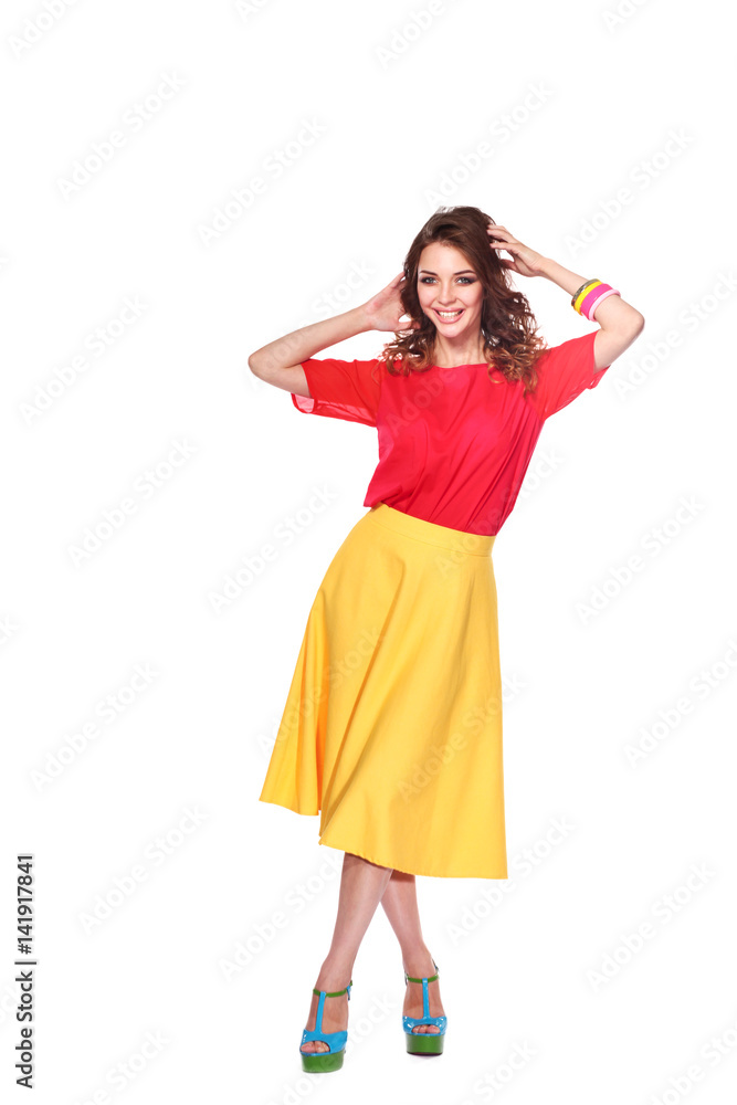 Beautiful woman with curly hair wearing a red jacket, isolated on white background