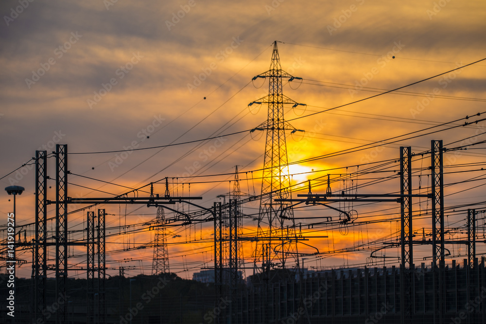 Silhouette of the electricity transmission pylon at sunset