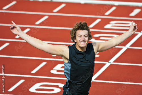 A male athlete celebrates winning. © Rapt.Tv