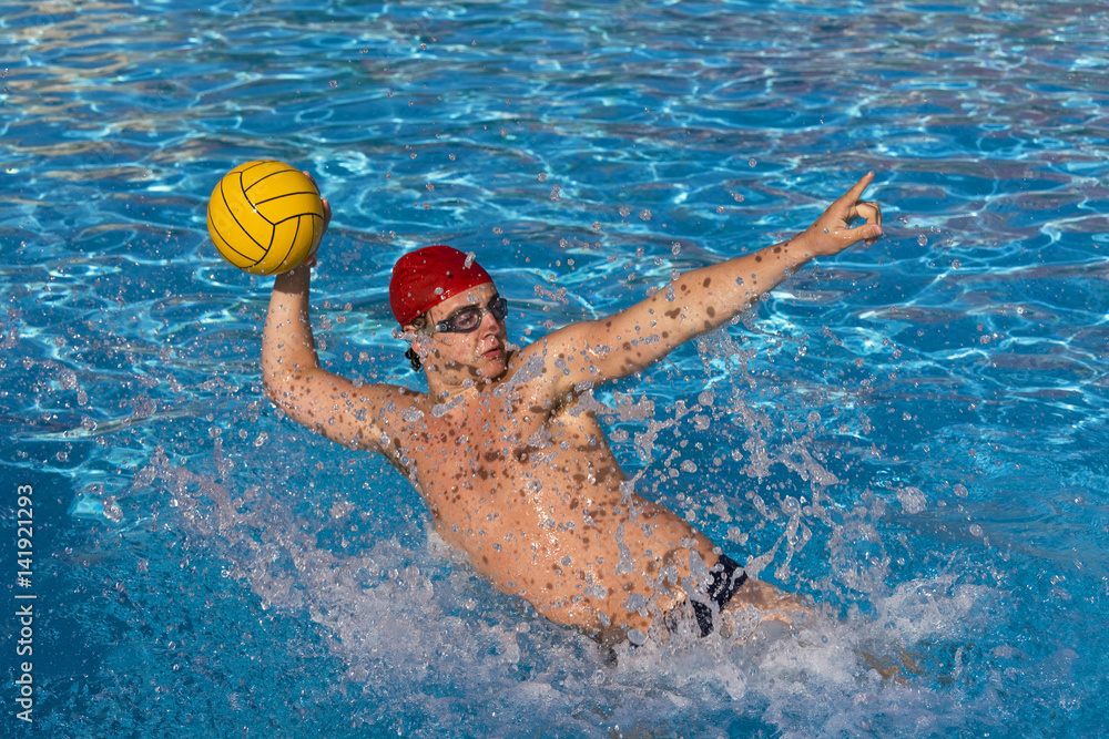 A water polo player gets ready to pass.