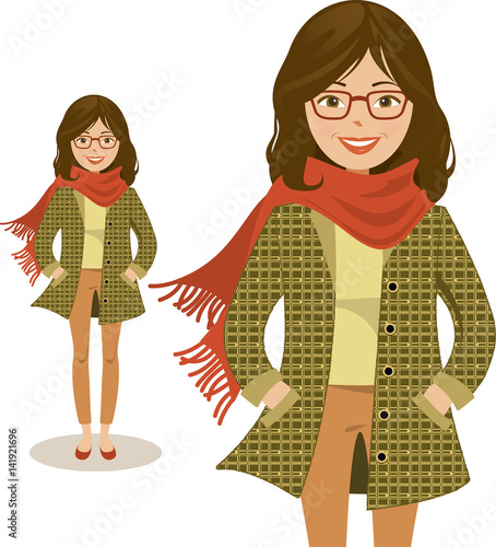 Young, smiling woman with hands in pockets, wearing glasses, warm jacket and scarf