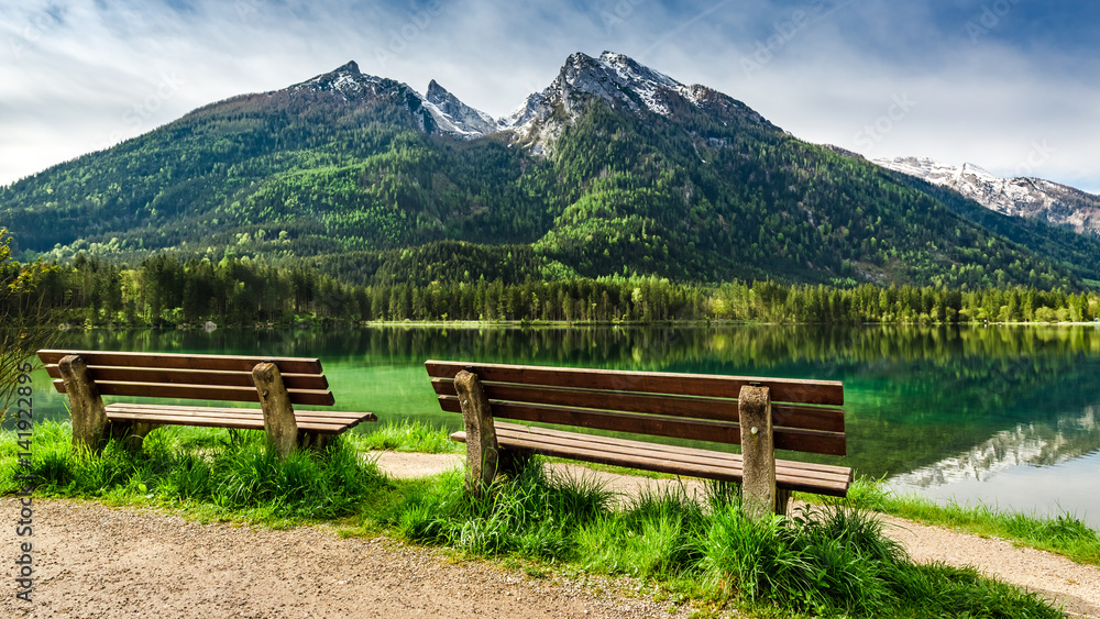 Two wooden bench at Hintersee lake in the Alps, Europe