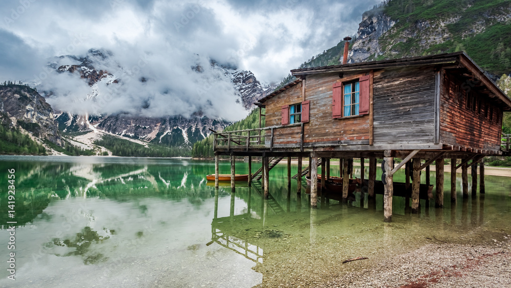 Fototapeta premium Stormy clouds over Pragser Wildsee in Dolomites, Europe
