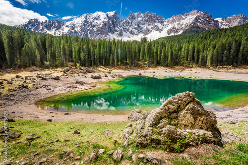 Stunning view to mountain Carezza lake in Dolomites, Italy, Europe