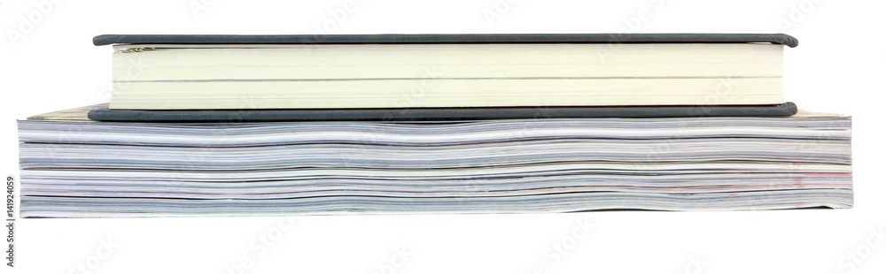 Book atop magazine showing side ends of pages. Isolated. Book atop magazine showing side ends of pages. Isolated.