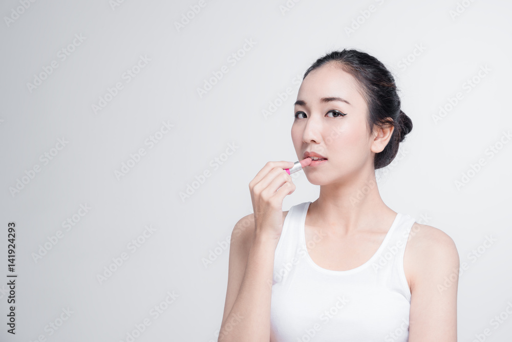 Asian woman with beautiful skinface non make up,pure cosmetic holding brush isolated on white background Asian woman with beautiful skinface non make up,pure cosmetic holding brush isolated on white background
