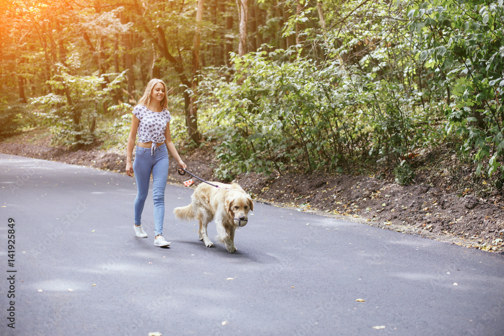 couple walking outdoors with her dog couple walking outdoors with her dog
