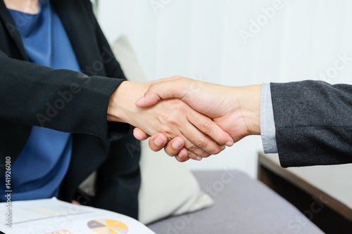 Wallpaper Mural Business man and woman hand shaking after meeting at office, close up Torontodigital.ca