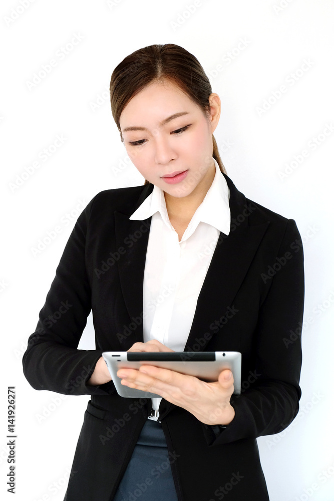 Asian businesswoman using tablet isolated on white background, business and technology concept, young female leader Asian businesswoman using tablet isolated on white background, business and technology concept, young female leader