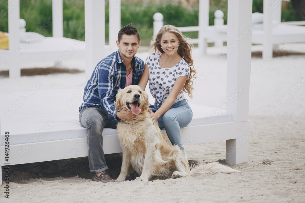 couple walking outdoors with her dog couple walking outdoors with her dog