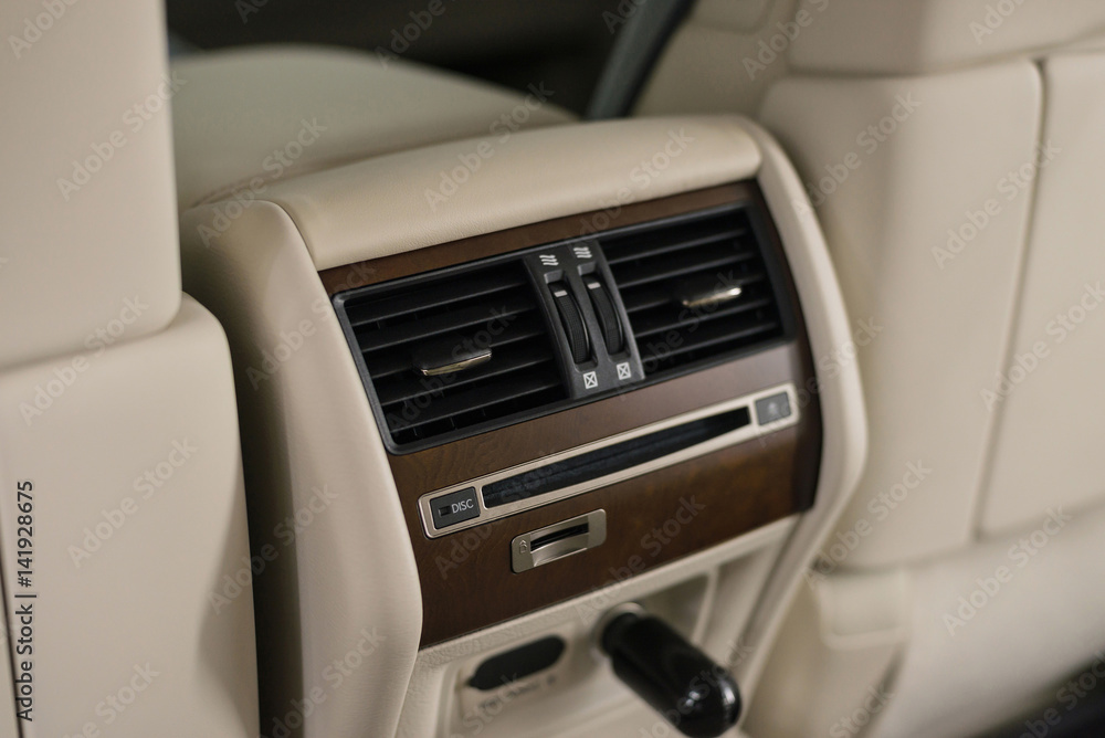 Four zone climate control. Car interior detail. Back passenger air vents. Four zone climate control. Car interior detail. Back passenger air vents.