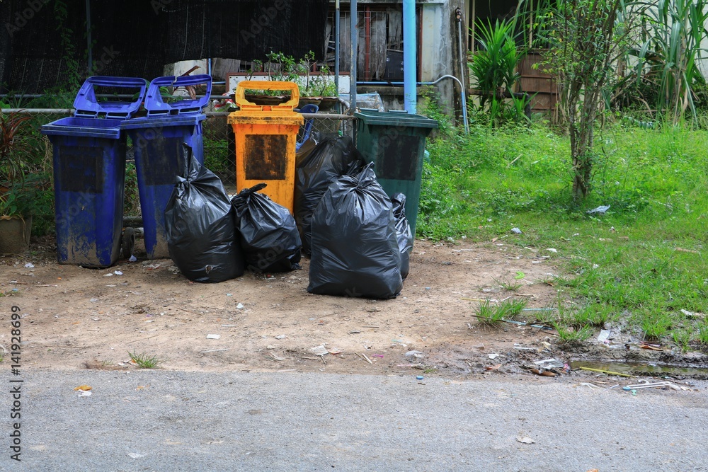 Pile black garbage bag roadside in the city Pile black garbage bag roadside in the city