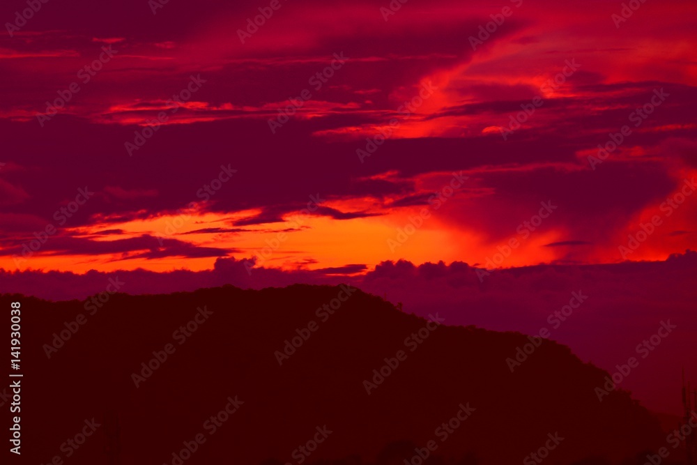 Obraz premium sunset in sky and cloud, beautiful colorful twilight time with mountain silhouette