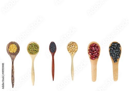 Vareity of Whole grain beans in wood spoon isolated on white background