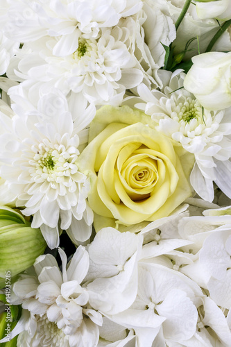 Floral arrangement with lilies, roses, eustoma, chrysanthemum and hortensia flower.