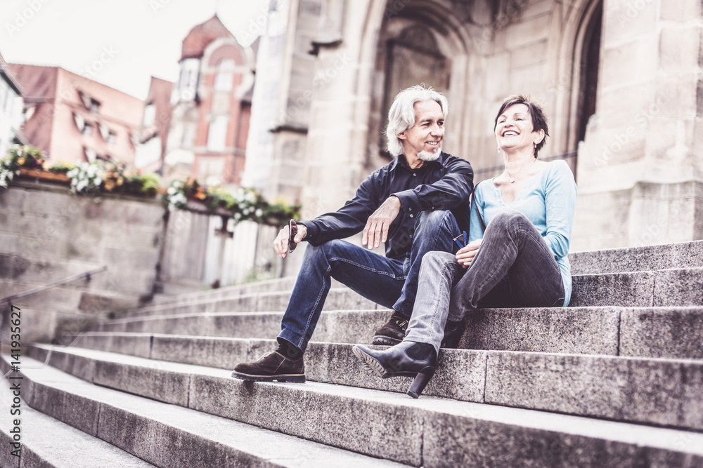 Senior Couple Taking A Rest Next To Church Senior Couple Taking A Rest Next To Church