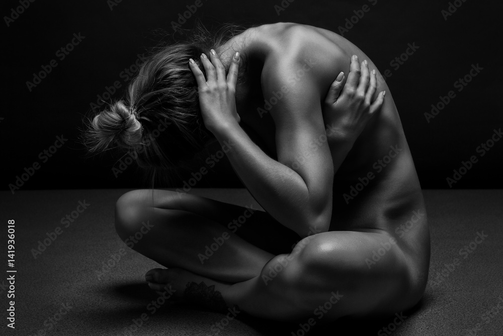 Athletic Naked woman body on black background. Fine art photo of female body.  Stock Photo | Adobe Stock