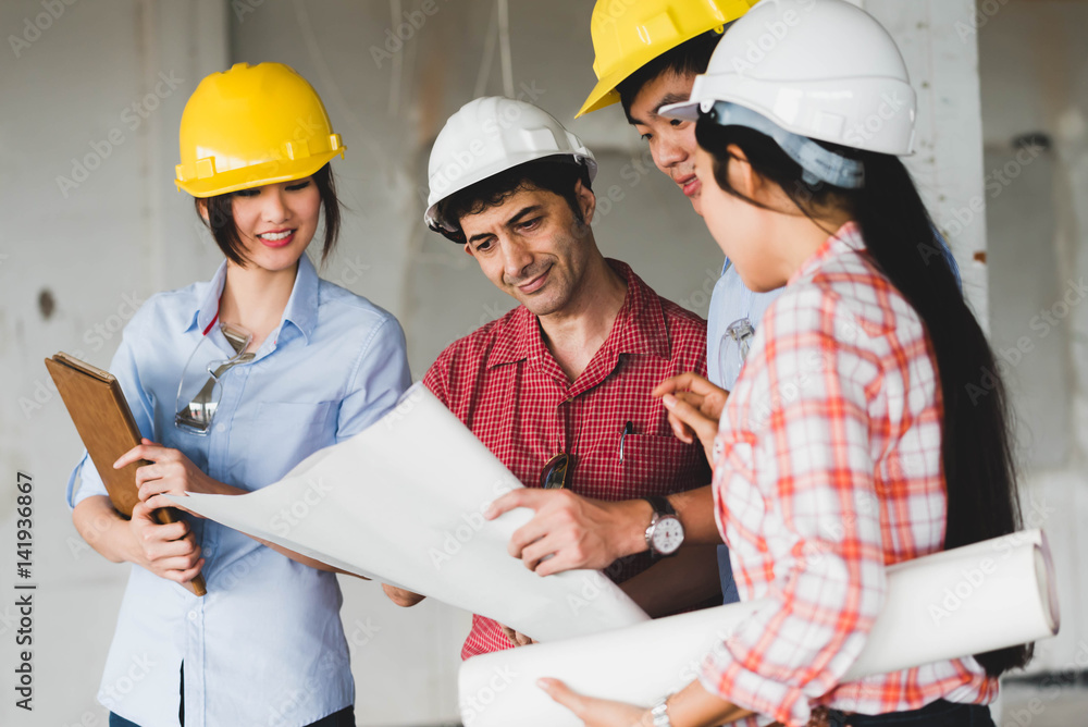 Four construction engineer working in side building plan for renovation, construction engineering conceptual Four construction engineer working in side building plan for renovation, construction engineering conceptual