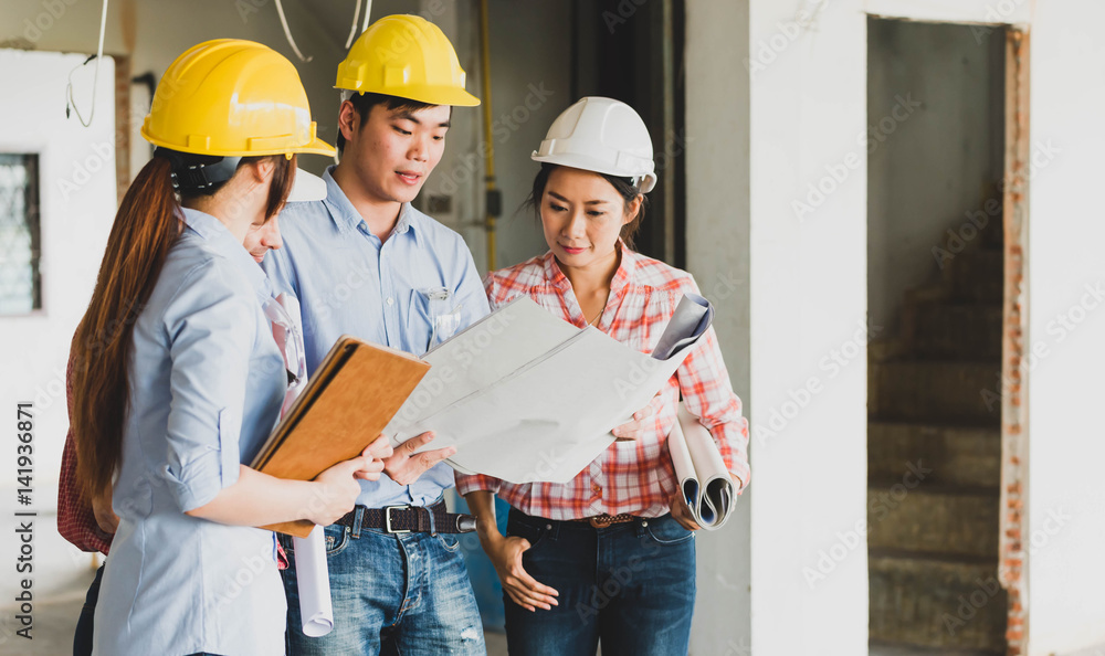 Four construction engineer working in side building plan for renovation, construction engineering conceptual Four construction engineer working in side building plan for renovation, construction engineering conceptual