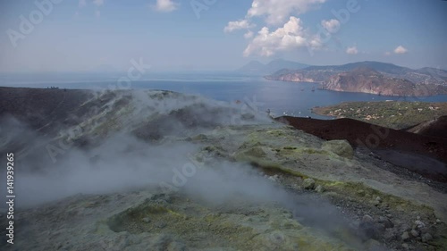 The incredible vulcano island off the coast of Sicily, Italy. vulcano has constant sulphurous fumes coming up through its vents in the crator photo