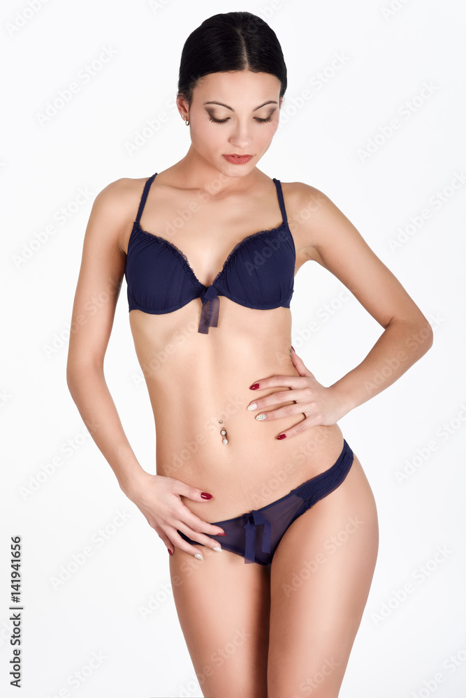 Beautiful brunette girl, model of fashion, wearing blue underwear. Stock  Photo | Adobe Stock