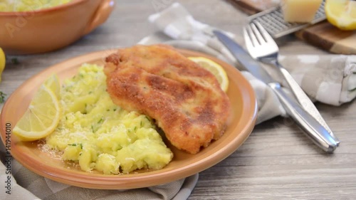 Schnitzel breadead with parmesan mashed potatoes photo