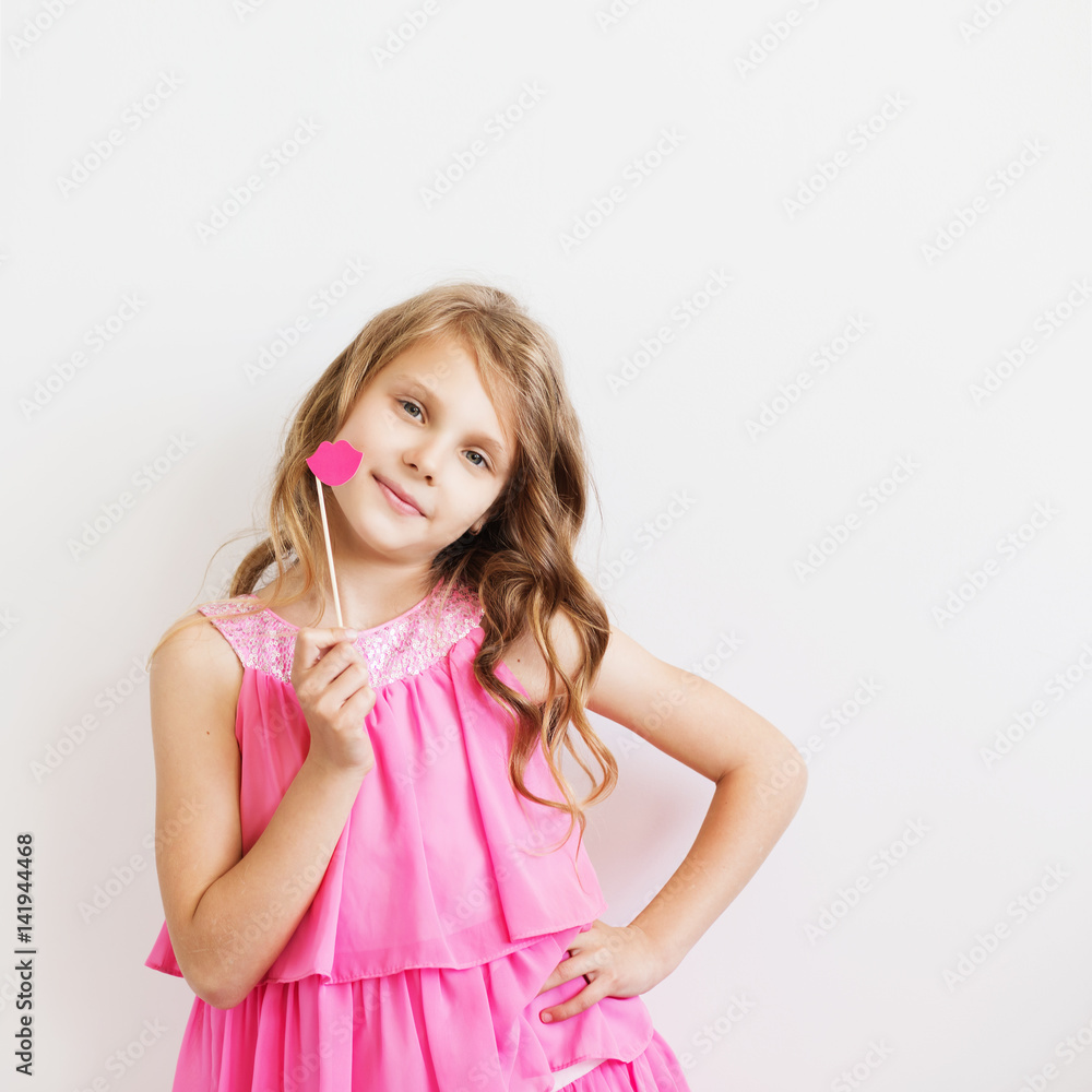 Portrait of a lovely little girl with funny pink paper lips Portrait of a lovely little girl with funny pink paper lips