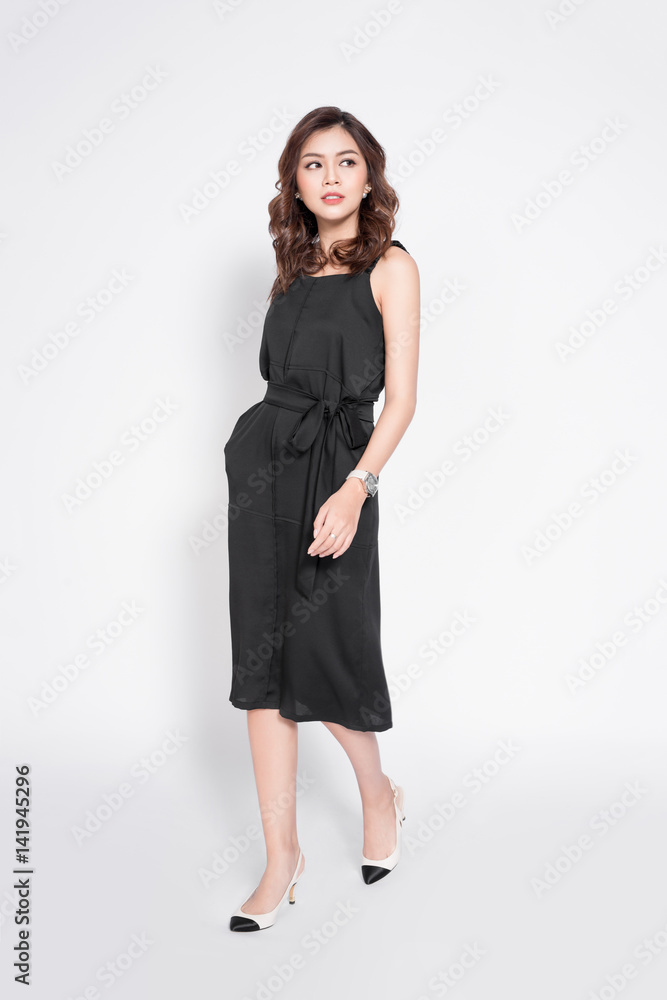 Full length of beautiful stylish asian woman in elegant casual black outfit posing Full length of beautiful stylish asian woman in elegant casual black outfit posing