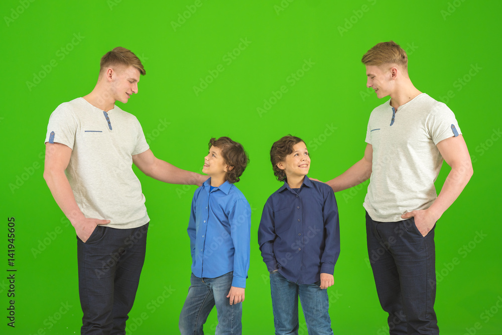The four brothers stand on the green background The four brothers stand on the green background