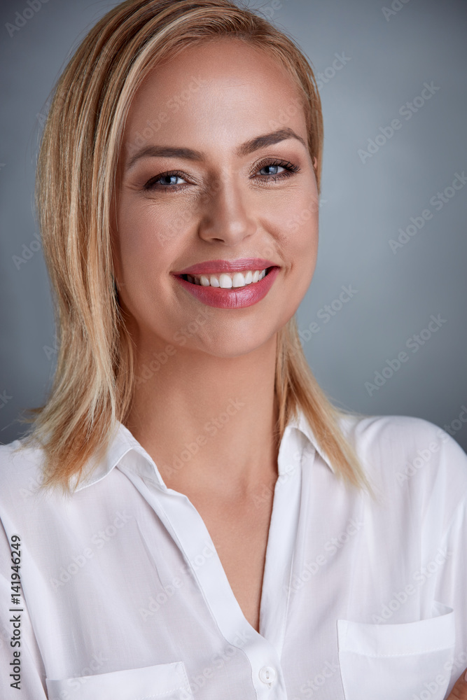 Attractive middle-aged blond woman with a beautiful smile Attractive middle-aged blond woman with a beautiful smile