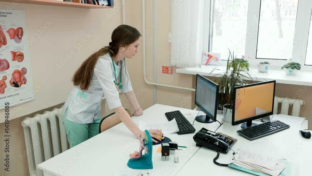 Young girl doctor at the computer Young girl doctor at the computer