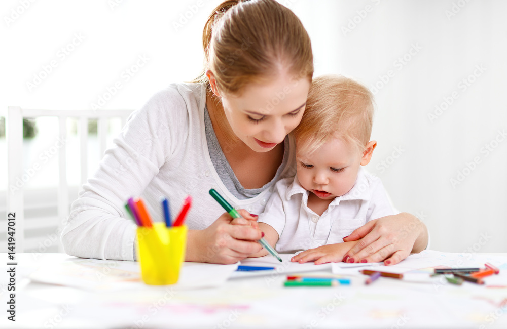 Mother with baby son with colored pencils Mother with baby son with colored pencils