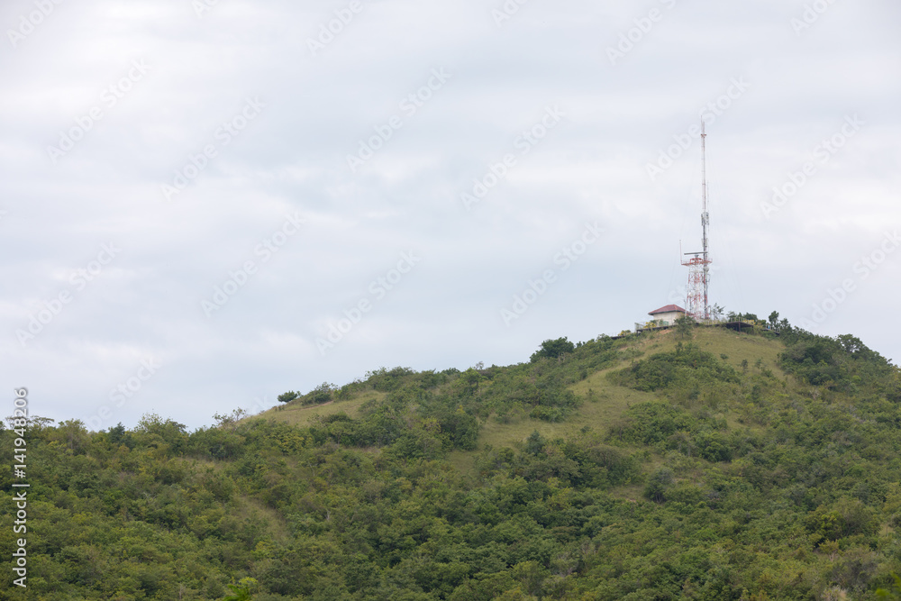 tower with data transmission equipment on green hill in Thailand
