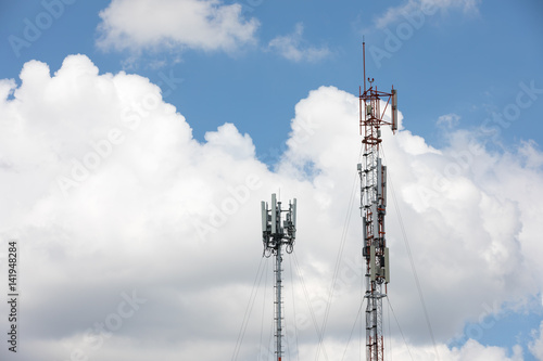 Towers for receiving data on blue sky background