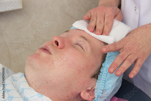 Professional acne facial cleansing in the cabin © Oksana Bessonova