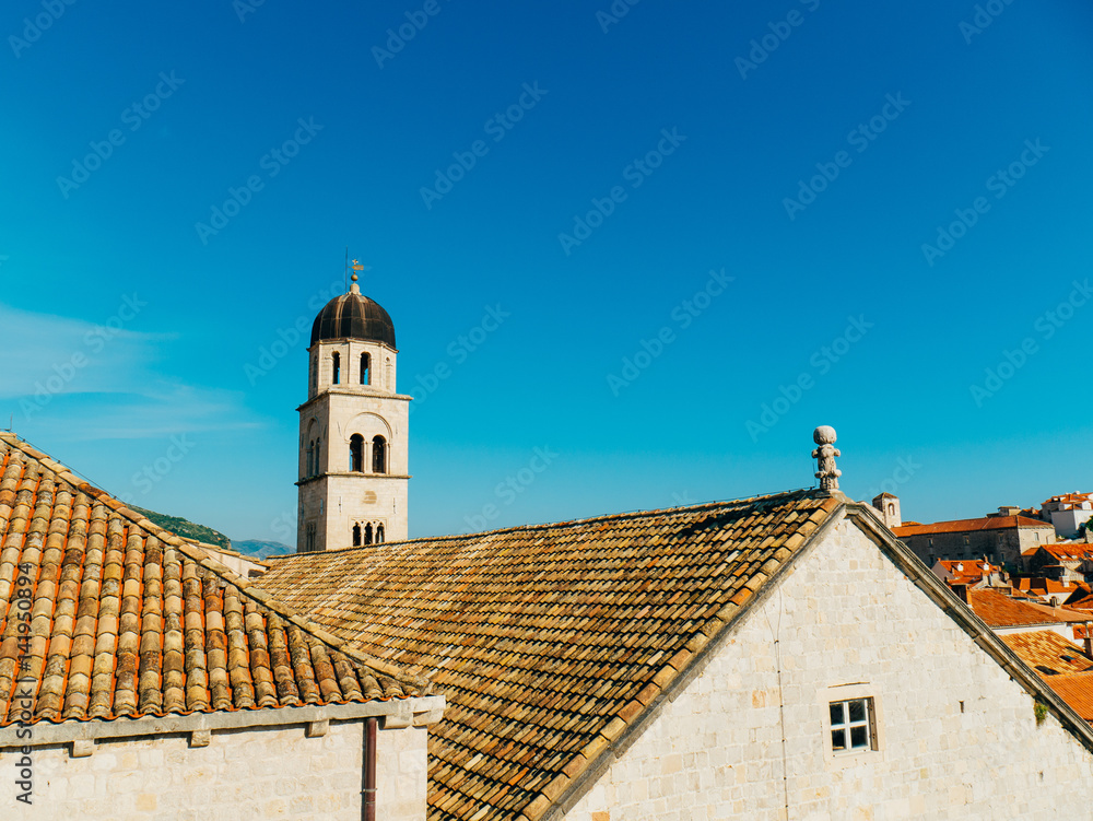 Dubrovnik Old Town, Croatia. Tiled roofs of houses. Church in the city. City View from the wall.
