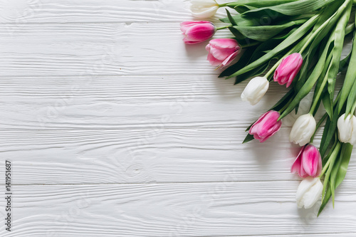 Fototapeta Naklejka Na Ścianę i Meble -  Tulips on a wooden background for Mother's Day.