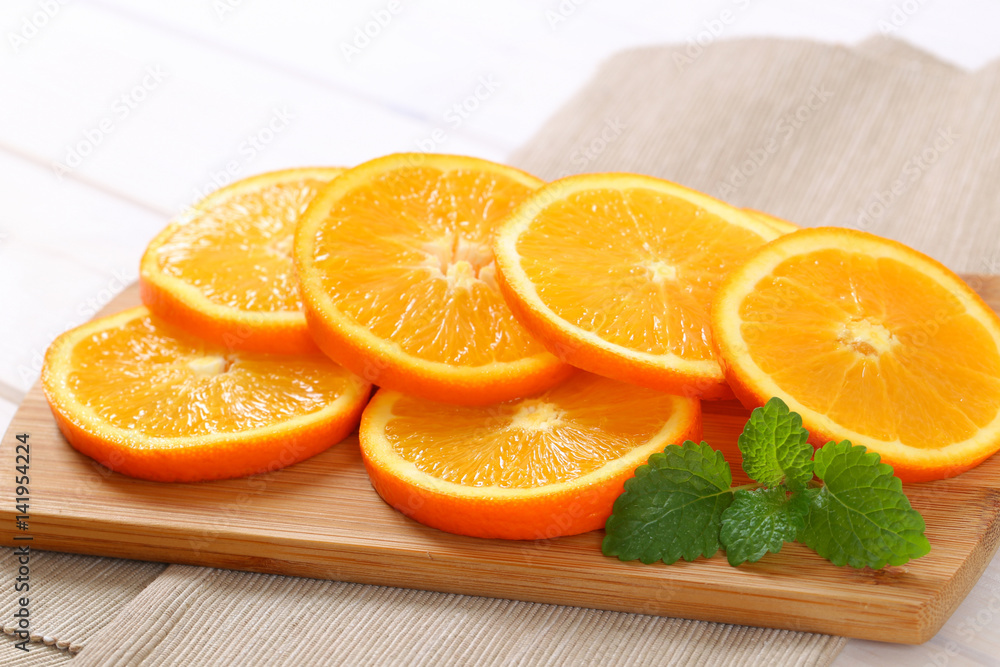 thin slices of fresh orange thin slices of fresh orange