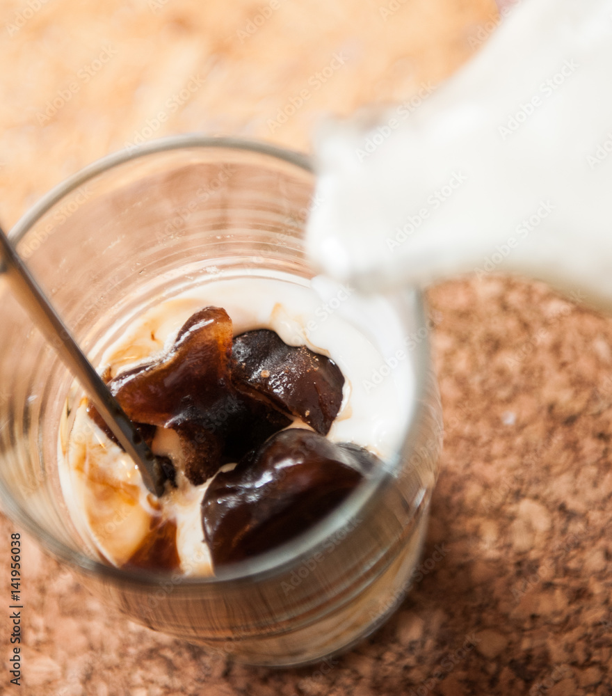 Fototapeta premium Ice made from coffee with milk. Shot of ice coffee.