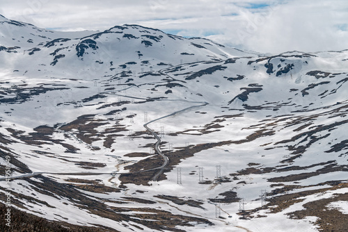 Snow wall on the road Tindevegen - the highland road in Norway. photo