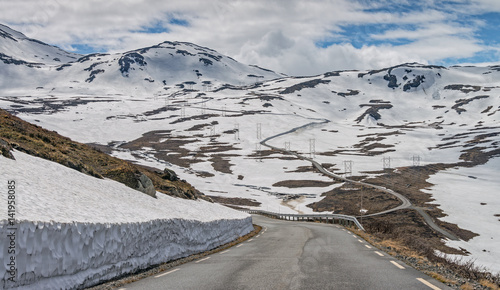 Snow wall on the road Tindevegen - the highland road in Norway. photo