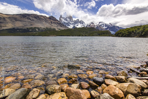 Fitz Roy mountain and lake capri with yellow stones on bank