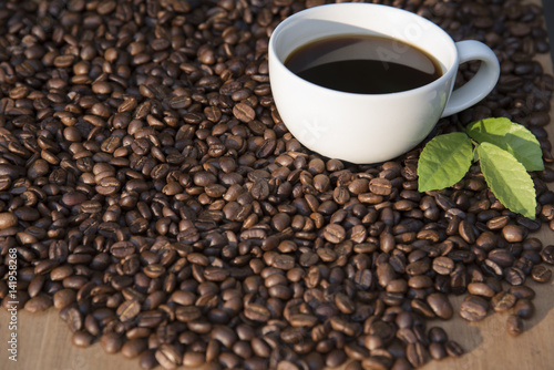 cup of coffee top on coffee beans background